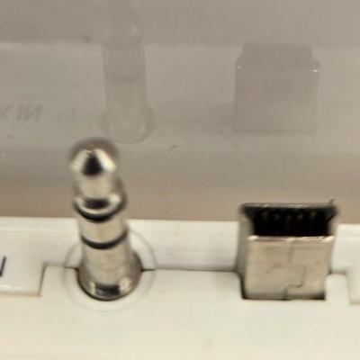 LOT 144L: Disney Mix Max Digital Music Player (Orange High School Musical) w/ 7 "Tapes" & Dock Model D9-15-950