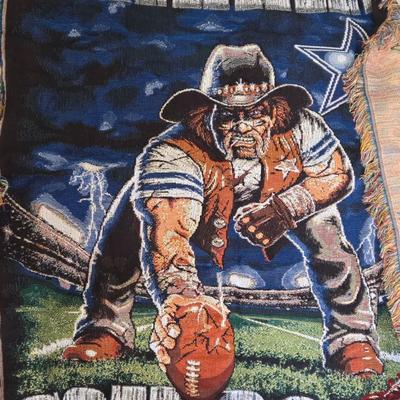 LOT 147B: Three Dallas Cowboy Blankets : The One with the Man on it is 64x46, The One with the Helmet is 58x46, The One with the Star is...