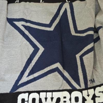 LOT 147B: Three Dallas Cowboy Blankets : The One with the Man on it is 64x46, The One with the Helmet is 58x46, The One with the Star is...