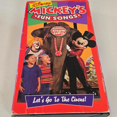 LOT 151L: All Things Disney, Including VHS Tapes, Wall Decal, Latch Hook Rug Kit, Magnets, & More