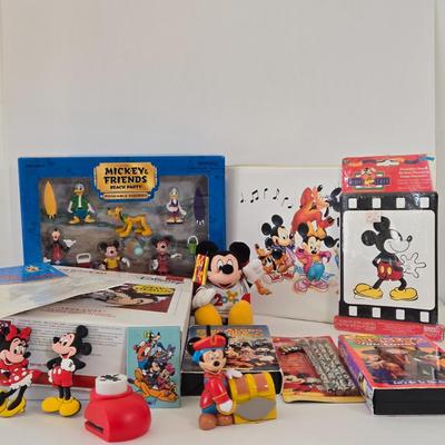 LOT 151L: All Things Disney, Including VHS Tapes, Wall Decal, Latch Hook Rug Kit, Magnets, & More