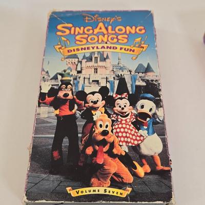 LOT 151L: All Things Disney, Including VHS Tapes, Wall Decal, Latch Hook Rug Kit, Magnets, & More