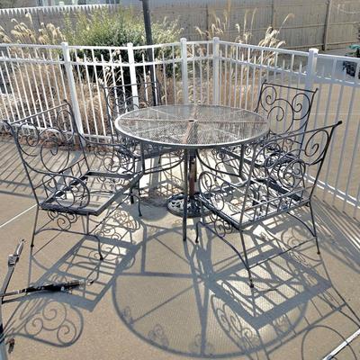 LOT 162 O: Disney's Mickey Mouse Wrought Iron Table w/ 4 Chairs & Black Metal Umbrella Stand