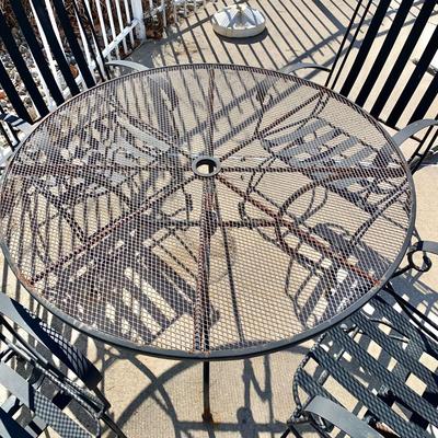 LOT 163 O: Wrought Iron Patio Set; Table & 4 Rocker Chairs