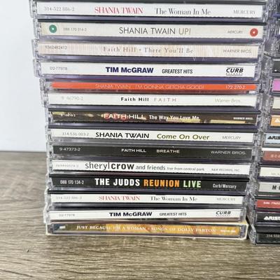 LOT 182B: CD Collection: Dolly Parton, Whitney Houston, Aretha Franklin, Patti LaBelle, Donna Summer, Shania Twain, Faith Hill & More