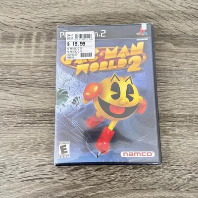 LOT 193A: PlayStation 2 PS2 Video Games: NIP Disney Golf, NIP DDR Super Nova 2, NIP Pac Man World 2, NIP Finding Nemo Game, Disney's...