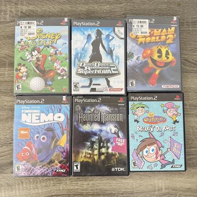 LOT 193A: PlayStation 2 PS2 Video Games: NIP Disney Golf, NIP DDR Super Nova 2, NIP Pac Man World 2, NIP Finding Nemo Game, Disney's...