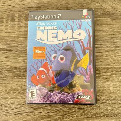 LOT 193A: PlayStation 2 PS2 Video Games: NIP Disney Golf, NIP DDR Super Nova 2, NIP Pac Man World 2, NIP Finding Nemo Game, Disney's...