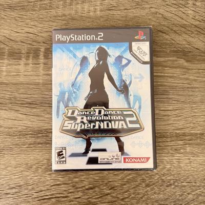 LOT 193A: PlayStation 2 PS2 Video Games: NIP Disney Golf, NIP DDR Super Nova 2, NIP Pac Man World 2, NIP Finding Nemo Game, Disney's...