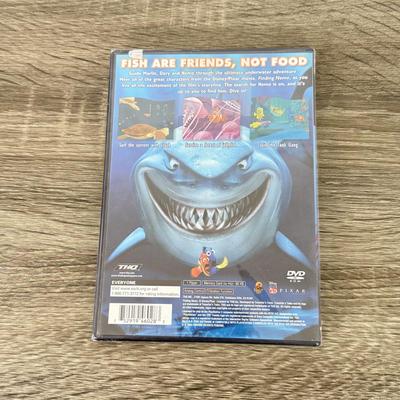 LOT 193A: PlayStation 2 PS2 Video Games: NIP Disney Golf, NIP DDR Super Nova 2, NIP Pac Man World 2, NIP Finding Nemo Game, Disney's...