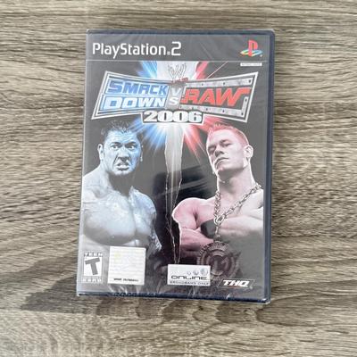 LOT 194B: PlayStation & PS2 Video Games: NIP Austin Powers Pinball, NIP Test Drive Off-Road, NIP NBA Live '06, NIP WWF Smack...