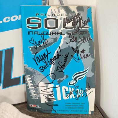 LOT 219B: Philadelphia Soul Football Collection: T-Shirts, Signed Program, Banner & Teddy Bear