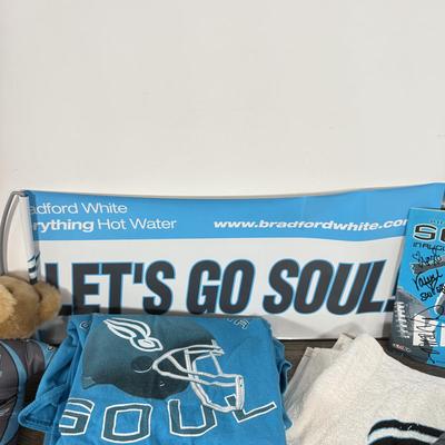 LOT 219B: Philadelphia Soul Football Collection: T-Shirts, Signed Program, Banner & Teddy Bear