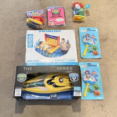 LOT 226L: NIP Water Toys: Swimline Arcade Shooter Target Game, Shift the Black Series RC Boat Racer & More