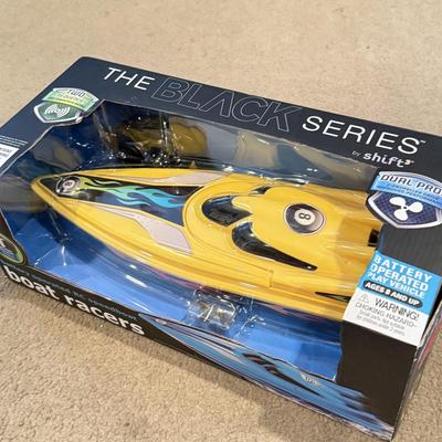 LOT 226L: NIP Water Toys: Swimline Arcade Shooter Target Game, Shift the Black Series RC Boat Racer & More