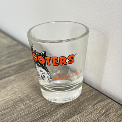 LOT 239B: Hooters Collection: Racing Champions NASCAR 2002 1:64 Transporter and Die-Cast Stock Car, Shot Glass & Motorcycle Pin