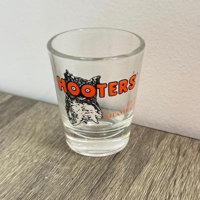 LOT 239B: Hooters Collection: Racing Champions NASCAR 2002 1:64 Transporter and Die-Cast Stock Car, Shot Glass & Motorcycle Pin