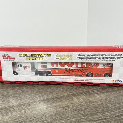LOT 239B: Hooters Collection: Racing Champions NASCAR 2002 1:64 Transporter and Die-Cast Stock Car, Shot Glass & Motorcycle Pin