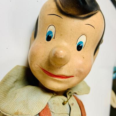 LOT 331: Vintage Composite Disney Pinocchio Doll (see description) and Disneyland Booklet and Map