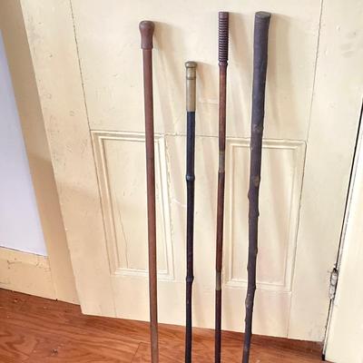 LOT 369: Four Vintage Wooden Walking Sticks
