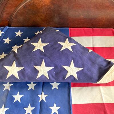 LOT 370: Collection of American Flags - Veteran Honored Folded in Wooden Case, Folded Best Valley Forge Brand and More