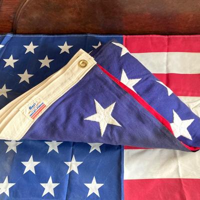 LOT 370: Collection of American Flags - Veteran Honored Folded in Wooden Case, Folded Best Valley Forge Brand and More