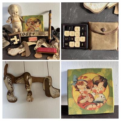 LOT 404 Well Loved Antique Toy Collection: Rudolph Steiner Co. The 15 Puzzle Bakelite Game w/Storage, Composition Doll, Nosey Hound...
