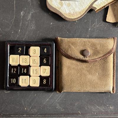 LOT 404 Well Loved Antique Toy Collection: Rudolph Steiner Co. The 15 Puzzle Bakelite Game w/Storage, Composition Doll, Nosey Hound...