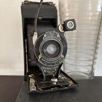 LOT 422: Vintage Kodak Collection: Dark Room Lantern, Dark Room Footed Beaker & No. 1A Pocket Camera