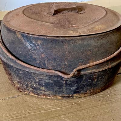 LOT 435: Antique/Vintage Long Cast Iron Oval Griddle with Spout, Oval Cast Iron Pot with Lid, Butcher's Clever with Wood Handle and...