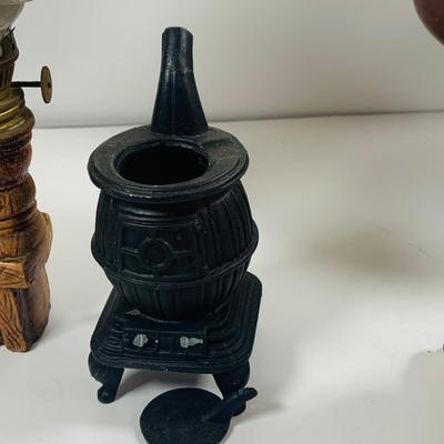 LOT441: Americana Collection Including 2 Cast Iron Miniature Cast Iron Pot Belly Stoves, a Ceramic Spinning Wheel Oil Lamp, Ceramic Owl,...