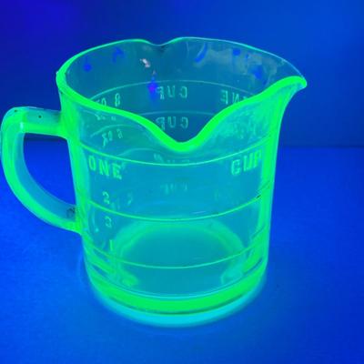 LOT444: Vintage Uranium Glass Measuring Cup, Mini Wood Rolling Pins, Mini Cake Pans, Mini Bunt Cake Pans and a Glass Hen on a Nest