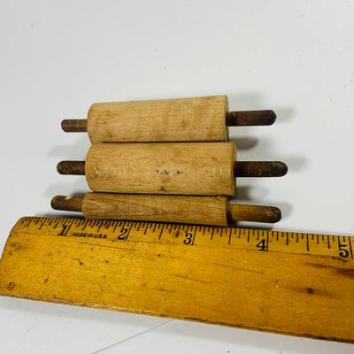 LOT444: Vintage Uranium Glass Measuring Cup, Mini Wood Rolling Pins, Mini Cake Pans, Mini Bunt Cake Pans and a Glass Hen on a Nest