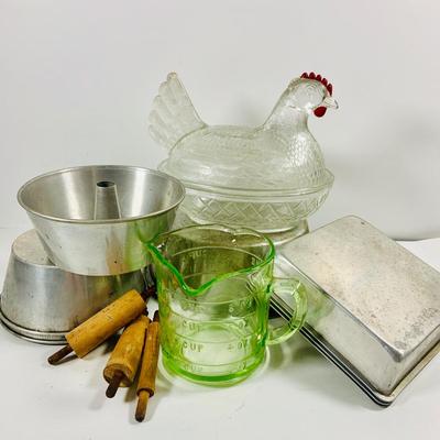 LOT444: Vintage Uranium Glass Measuring Cup, Mini Wood Rolling Pins, Mini Cake Pans, Mini Bunt Cake Pans and a Glass Hen on a Nest