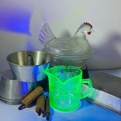 LOT444: Vintage Uranium Glass Measuring Cup, Mini Wood Rolling Pins, Mini Cake Pans, Mini Bunt Cake Pans and a Glass Hen on a Nest