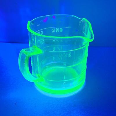 LOT444: Vintage Uranium Glass Measuring Cup, Mini Wood Rolling Pins, Mini Cake Pans, Mini Bunt Cake Pans and a Glass Hen on a Nest