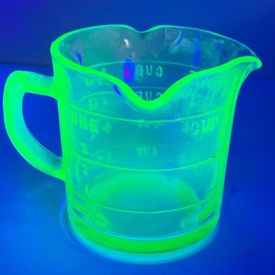 LOT444: Vintage Uranium Glass Measuring Cup, Mini Wood Rolling Pins, Mini Cake Pans, Mini Bunt Cake Pans and a Glass Hen on a Nest