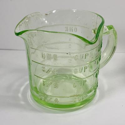 LOT444: Vintage Uranium Glass Measuring Cup, Mini Wood Rolling Pins, Mini Cake Pans, Mini Bunt Cake Pans and a Glass Hen on a Nest