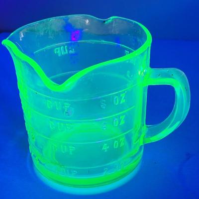 LOT444: Vintage Uranium Glass Measuring Cup, Mini Wood Rolling Pins, Mini Cake Pans, Mini Bunt Cake Pans and a Glass Hen on a Nest