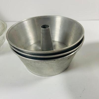 LOT444: Vintage Uranium Glass Measuring Cup, Mini Wood Rolling Pins, Mini Cake Pans, Mini Bunt Cake Pans and a Glass Hen on a Nest