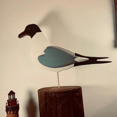 LOT450: Nautical Collection with Large Handcrafted Wooden Seagull on a Log, Wood Model Boat. Light-up Light House, Sea Shells and Kinetic...
