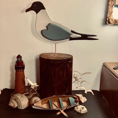 LOT450: Nautical Collection with Large Handcrafted Wooden Seagull on a Log, Wood Model Boat. Light-up Light House, Sea Shells and Kinetic...