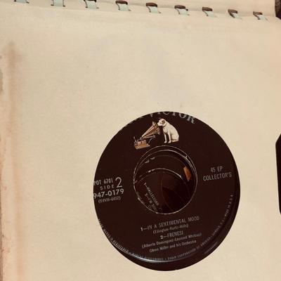 LOT 460: RCA Nipper Dog Plushes and a Book of Glenn Miller RCA 45's