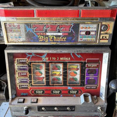 LOT 605: Vintage King of Carib Slot Machine