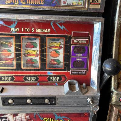 LOT 605: Vintage King of Carib Slot Machine