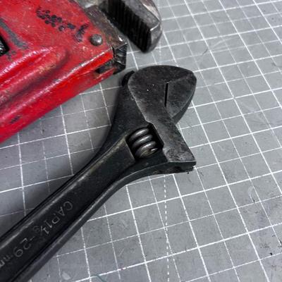 Pipe Wrench and a Crescent Wrench 