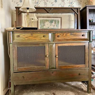 Sale Photo Thumbnail #91: Oak cabinet/buffet with metal lathe I. The doors