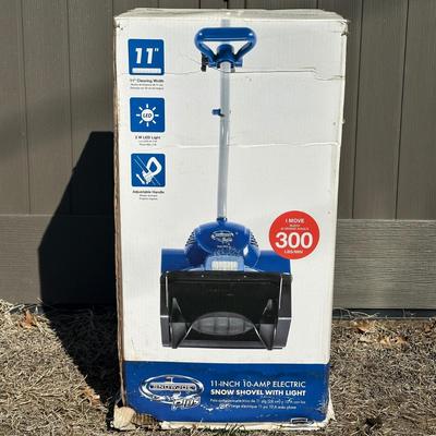 LOT 23D: Snow Joe Plus 11” Electric Snow Shovel w/ Light In Original Box