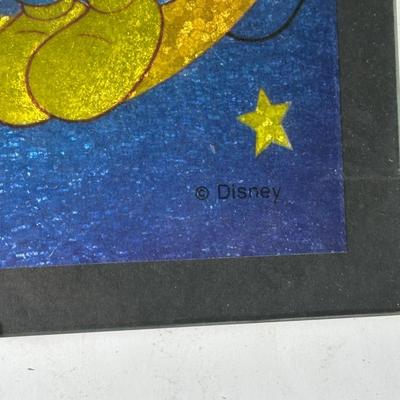 LOT 116A: Two Framed Disney Foil Artworks