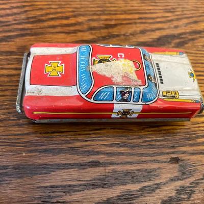 Cardboard farm with mini boot and tin car
